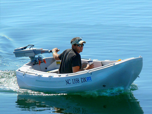 dinghy and sailboat